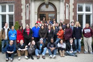 group photo of people in front of a building