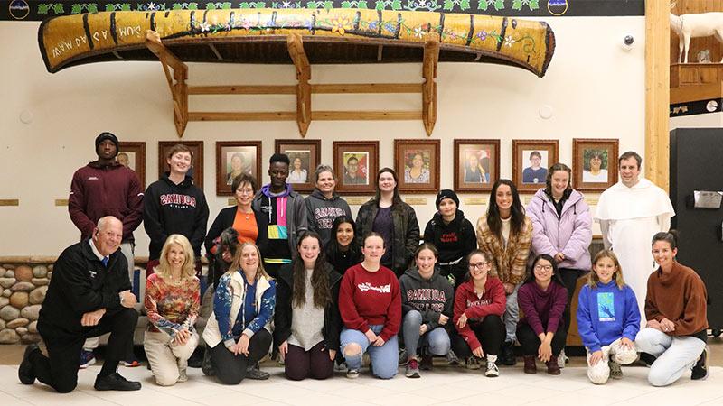 Students and staff pose for photo